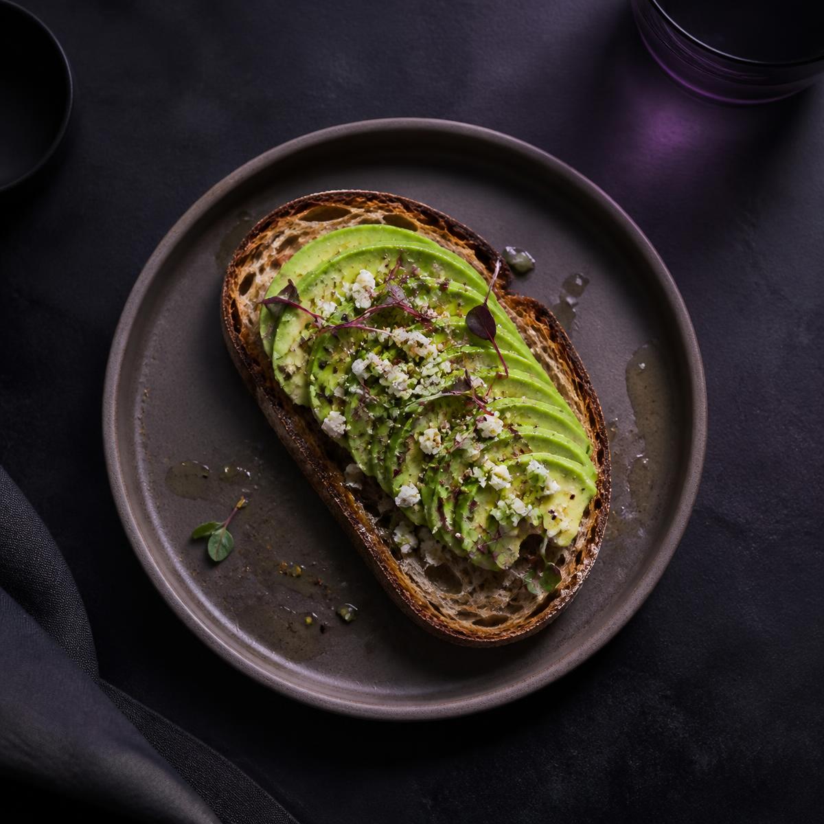 Avocado on sourdough with feta and micro herbs
